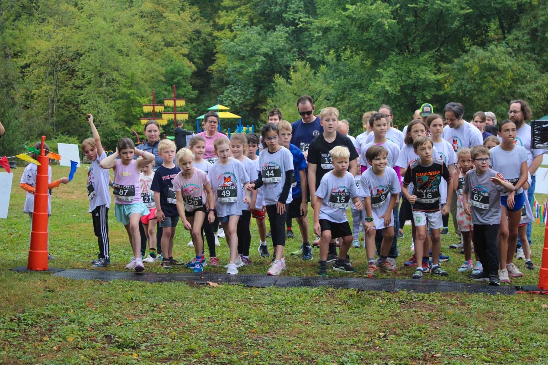 Runners on a wooded trail during the Fox Chapel 5K